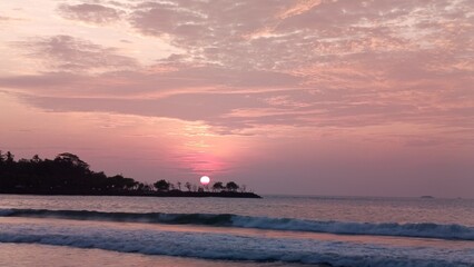 Soft Pink Sunset Over Shoreline