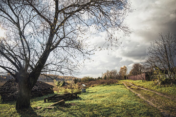 A dilapidated barn in a village in autumn
