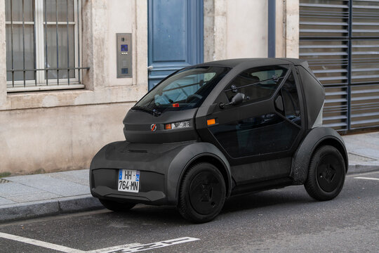 Nancy, France - January 15th 2026 : View on a matte black Mobilize Duo parked on a street. It's a two-seater electric quadricycle designed for urban mobility.
