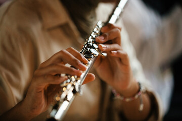 Close-up Female Musicians Playing Flute and Saxophone in Studio Rehearsal