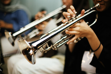Close-up Trumpet Player Practicing in a Music Rehearsal Room © maha