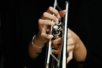 Close-up Trumpet Player Practicing in a Music Rehearsal Room © maha