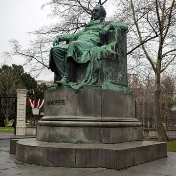 VIENNA, AUSTRIA - DECEMBER 04, 2017:  Statue of famous German author Johann Wolfgang von Goethe (designer Edmund Hellmer) outside the Hofburg Palace