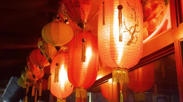Traditional vietnamese lanterns illuminating a night street in hoi an, creating a festive atmosphere and cultural decoration for a local restaurant in da nang