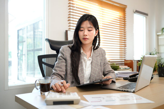 Finance planning, budget or savings manager calculating expenses, taxes or company profits with laptop, paperwork or calculator. female financial leader checking office staff payroll