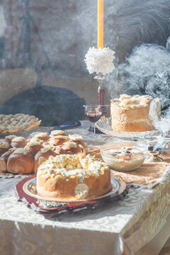 Serbian Slava table with bread, wheat, wine, and candle for Orthodox celebration