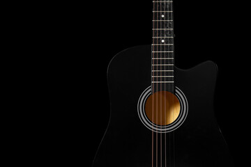 Obraz premium Modern black guitar on dark background, closeup