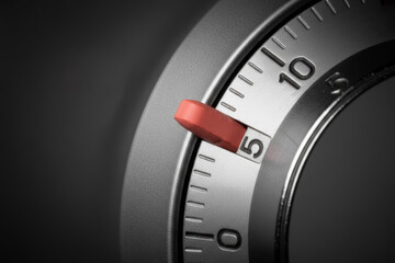 Automatic pill dispenser dial releasing red medicine tablet representing precise dosage control, healthcare technology and pharmaceutical compliance concept