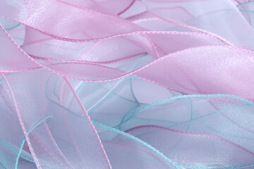 A background of curved organza ribbons in pastel colors