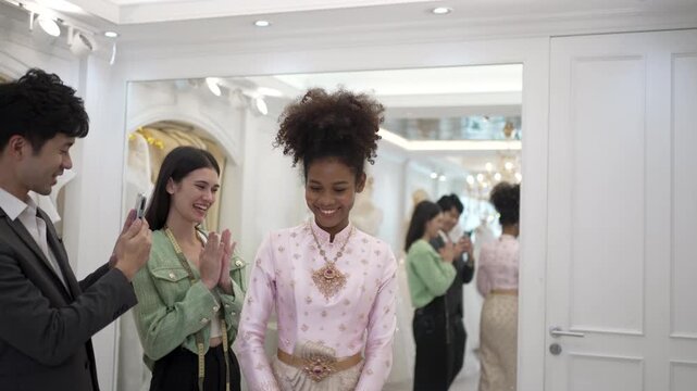 The couple is choosing dress for wedding event at wedding studio. Lifestyle, wedding event.