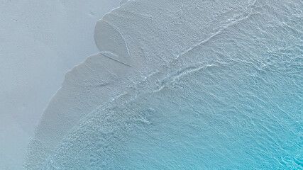 Aerial View of Turquoise Shoreline in a tropical Beach waves and Ocean