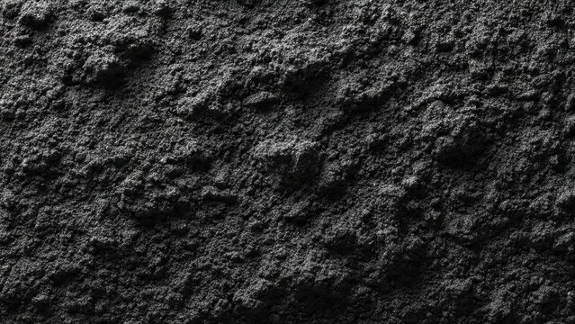 Textured Surface of Dark Gray Powder