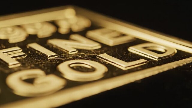 Macro shot of fine gold bar showing purity engraving. Luxurious and prestigious atmosphere representing wealth. Ideal for financial, investment, or banking marketing materials.