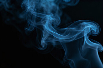 Ethereal Blue Vapor: A captivating display of wispy blue vapor swirls gracefully against a dark backdrop, creating an artistic blend of air and color, evoking a sense of calm and mystery.