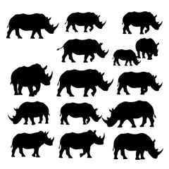 Set of rhino silhouettes isolated on white background in various positions © Deny