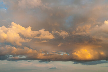 Picturesque sunset sky background, dramatic sunset sky with colorful golden clouds