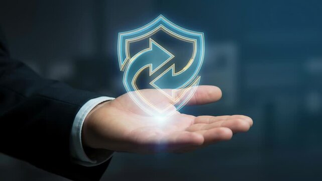 Businessman holding digital shield symbol representing secure online transaction and mobile payments in cashless banking economy with digital payments protecting financial data and trust hand
