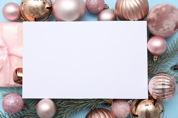 Blank card, Christmas balls, gift box and fir branches on blue background, closeup