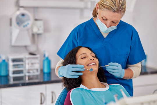 Mature dentist making treatment in modern clinic
