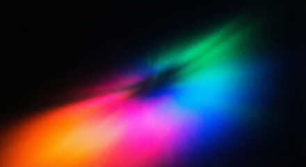 Vibrant rainbow light beams shine on dark background with colorful glow effects