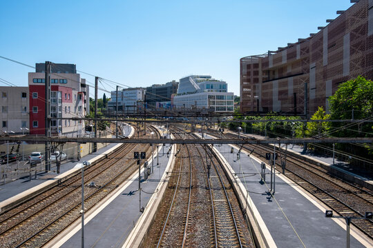 Long perspective along railway tracks in urban Montpellier France showing station context and transport infrastructure supporting city mobility