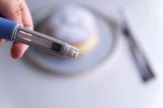 Like Ozempic Semaglutide Injection Pen Needle with medicine drop, diabetic patient preparing for subcutaneous treatment, weight loss medication and glucose control concept, close-up, copy space