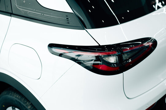 LED taillights of a modern SUV car in close-up. Taillight or rear light of modern sport car in showroom.