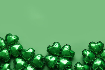 Balloons in shape of clover on green background. St. Patrick's Day celebration