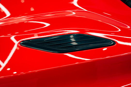 Close up detail on one of the LED headlights super car.