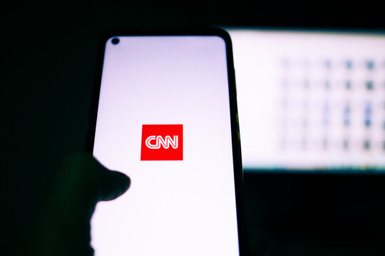 person opening CNN app on a phone