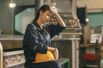 Young Asian woman worker hardwork in heavy industry, Engineer labor female tired fatigue exhausted