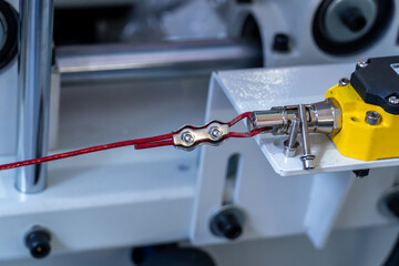 Industrial machine red emergency stop cord installation