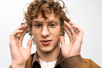 Charming young man showcases trendy style with great confidence and flair