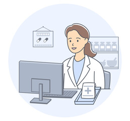 薬局のパソコンの前でオンライン服薬指導をする女性薬剤師