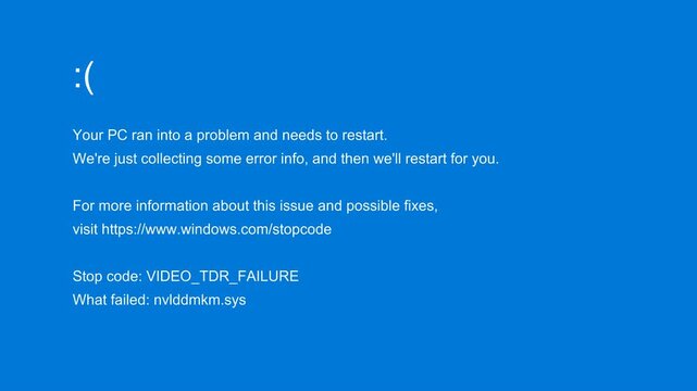 A critical system error results in a vibrant blue screen display, presenting a sad emoticon and technical failure information, indicating an unavoidable computer reboot