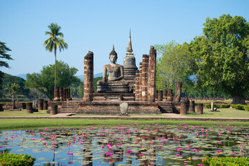 Fototapeta premium A view of the ruins of the ancient Buddhist temple of the Wat Chana Songkram on a sunny day. Sukhothai Historical Park, Thailand