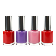 Obraz premium A row of four nail polish bottles in different colors against a white background. isolated on transparent background