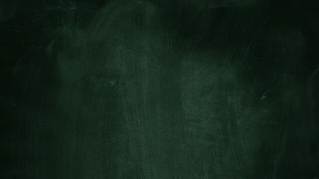 Green chalkboard texture with subtle chalk dust and worn surface. Classic school blackboard background ideal for education designs, menus, typography, posters and mockups.
