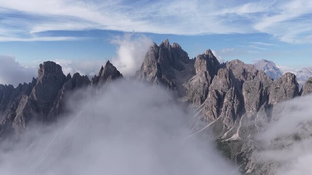 Aerial shot of moving clouds over the cadini di misurina mountain group in the dolomites
