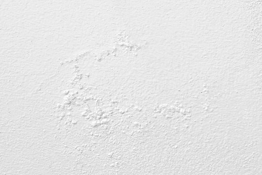 Peeling painted concrete wall. Leaking rain cause the wall cracked. Water damaged the wall.