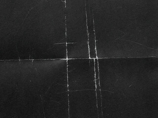 Gritty Folded Paper Texture Overlay. Distressed Creased Black Paper Background. Grunge Analog Scan Surface, Film  Texture © smishura