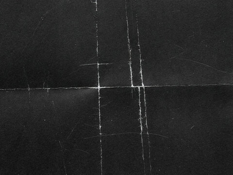 Gritty Folded Paper Texture Overlay. Distressed Creased Black Paper Background. Grunge Analog Scan Surface, Film  Texture