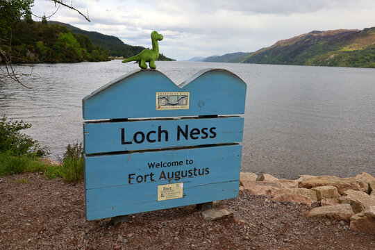 Loch Ness sign and Nessie doll in Scotland, UK