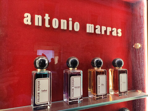 Rome, Italy - February 15, 2026: Antonio Marras perfume display featuring five distinct bottles on a red background with elegant branding and labels visible