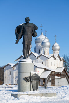 VELIKY NOVGOROD, RUSSIA - FEBRUARY 02, 2026: Monument to Alexander Nevsky on the background of the ancient Saints Boris and Geb church on a sunny February day
