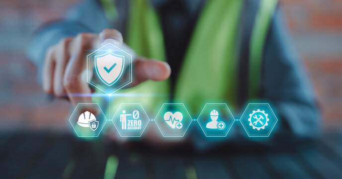 Engineer hand touching virtual safety shield check mark icon with zero accident goal interface for standard compliance, Occupational Health and Safety OHS, EHS Environment, Health, and Safety