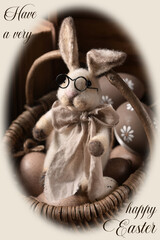 Vintage style Easter card with handicraft bunny in a wicker basket in sepia