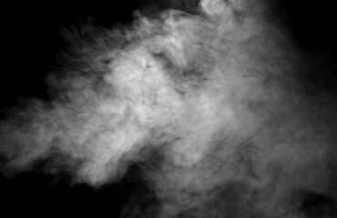 Realistic white smoke or steam isolated on black background. Abstract fog texture for overlay effect, vapor cloud, mist element and atmospheric design for creative compositing.