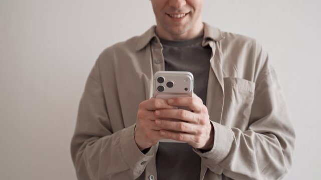 Man Using Apple iPhone 17 Pro Max Indoors