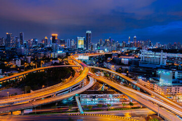 Views of streets and buildings in Bangkok, Thailand at night.